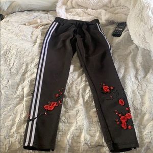 White striped bottoms with floral embroidery